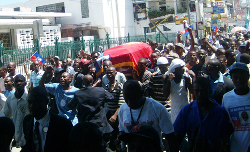 fr gerard jean juste haiti funeral march with coffin outside cathedral 061809 by c2a92009 jean ristil hip web
